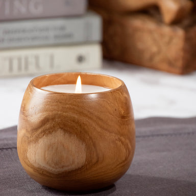 Candle poured in wood cup.