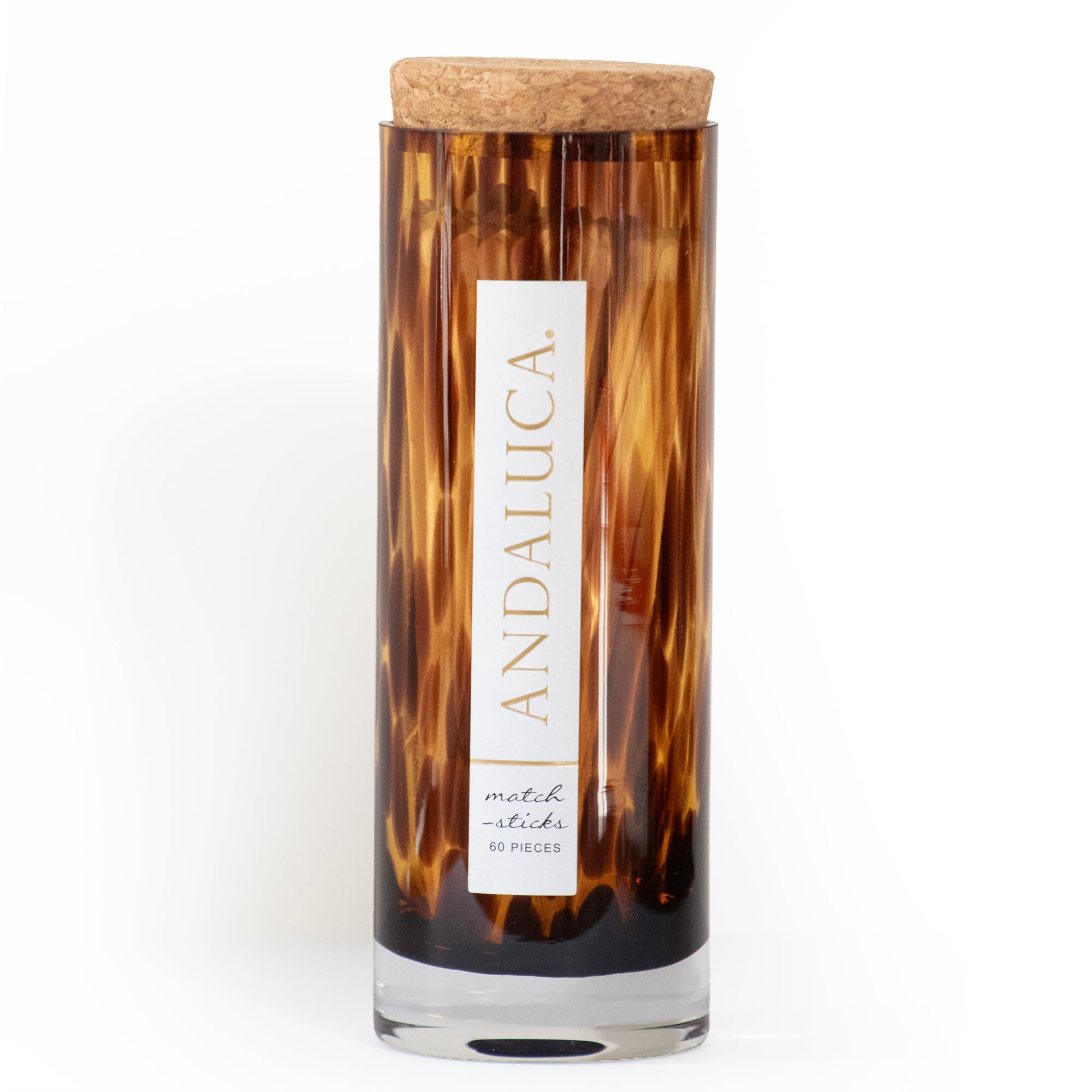Matches in brown tortoise glass jar with cork lid.