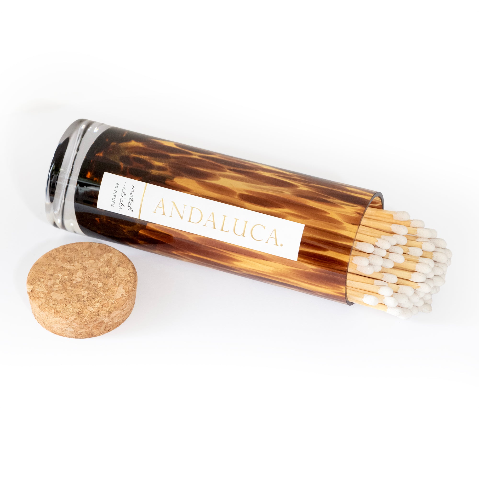 Matches in brown tortoise glass jar with cork lid.
