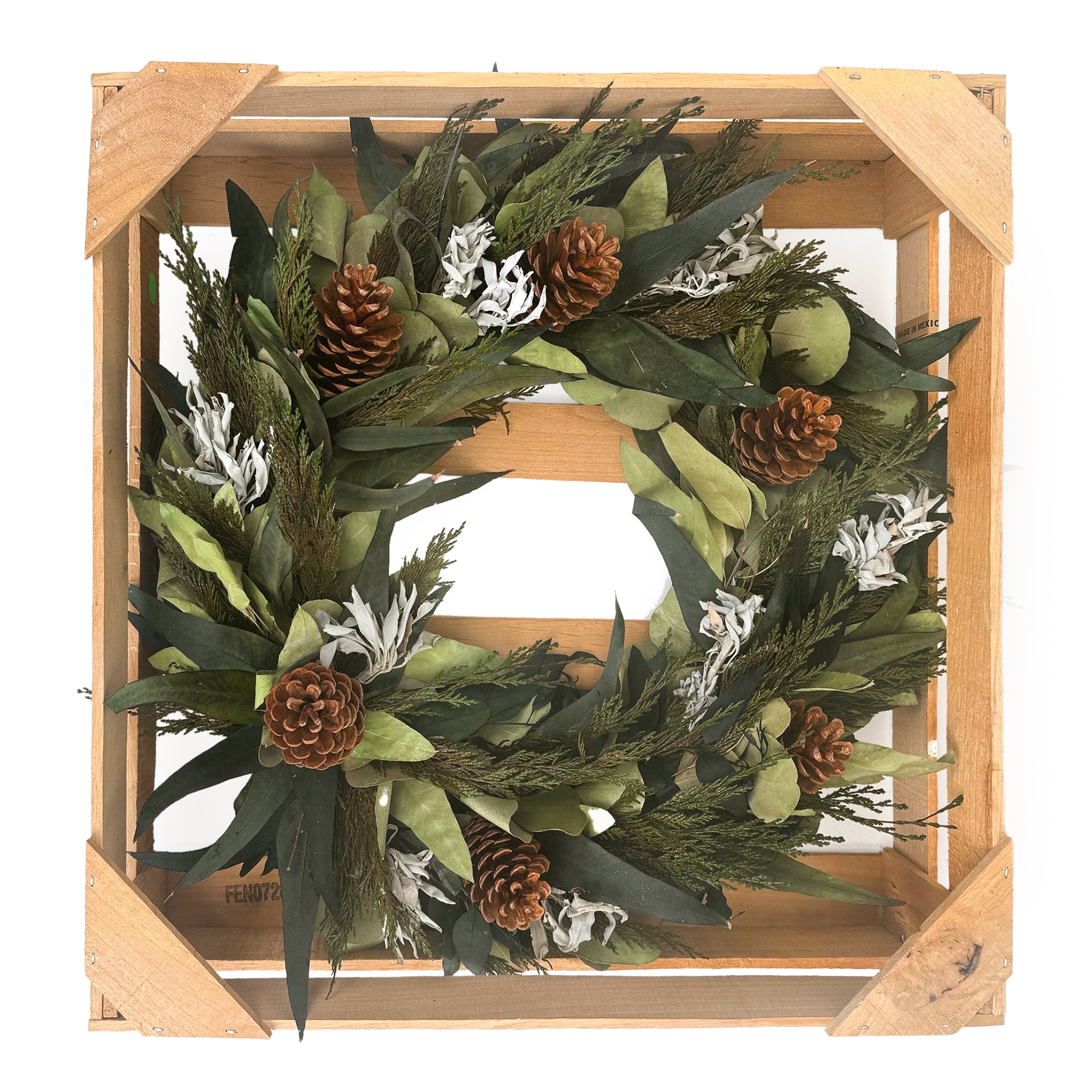 Winter Sage Haoliday wreath in a wooden frame.