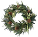 Winter Sage Haoliday wreath, filled with dried sage, willow eucalyptus leaves and accentuated with pinecones, on a white background.
