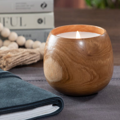 Candle poured into wood cup.