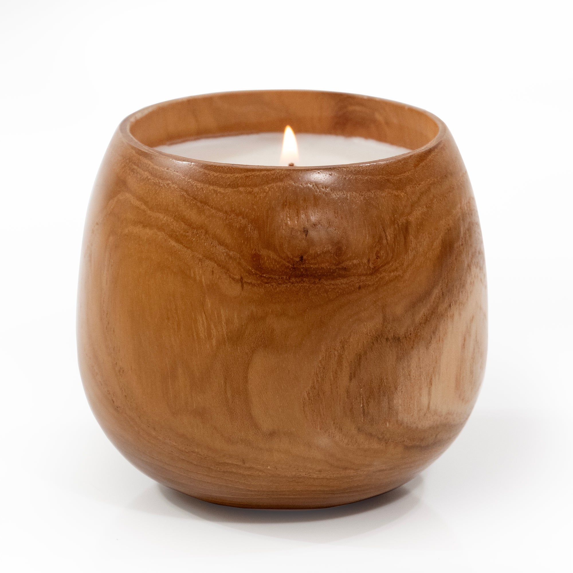 Candle poured into wood cup.