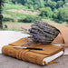 Cognac color Large Suede Leather Journal w/ Organic Cotton Paper Large. Showing it closed with a writing pen on top of it.